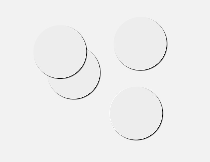 Photo blank white beer coasters on paper