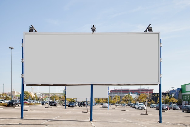 Blank white billboard in the parking lot