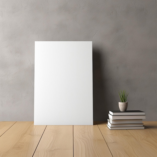 A blank white board with a plant on it next to a stack of books.