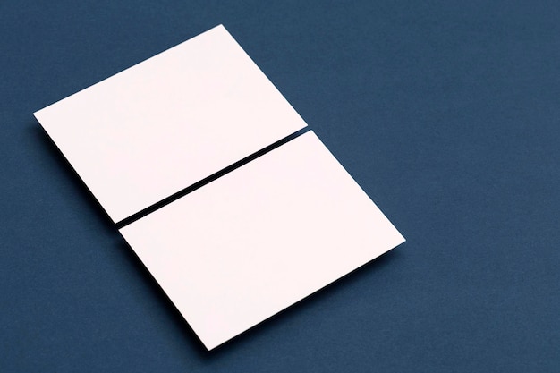 Blank white business card postcard flyer on a blue background