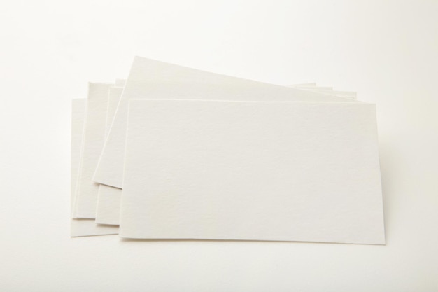 Blank white business cards on white paper background Mockup for branding identity Template for graphic designers portfolios