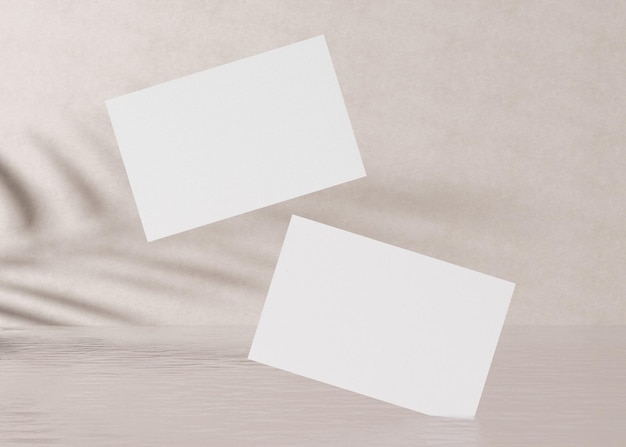 Blank white business cards with plants shadows on the cream background with water Natural mockup for branding identity Two cards to show both sides Template for graphic designer 3D rendering