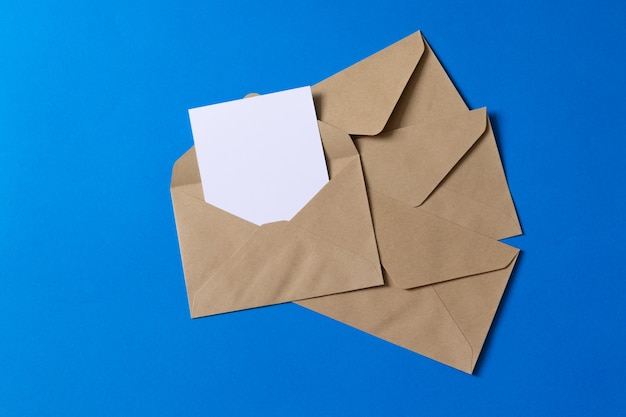 Blank white card with kraft brown paper envelope template mock up