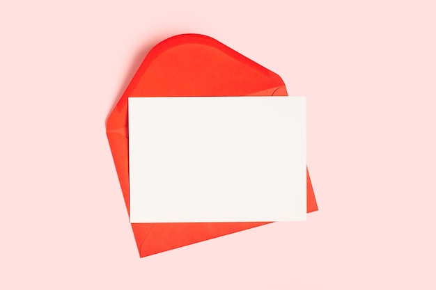 Blank white card with red paper envelope template mock up