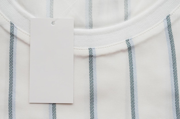 Blank white clothes tag label on new shirt