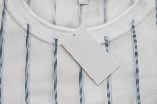 Blank white clothes tag label on new shirt