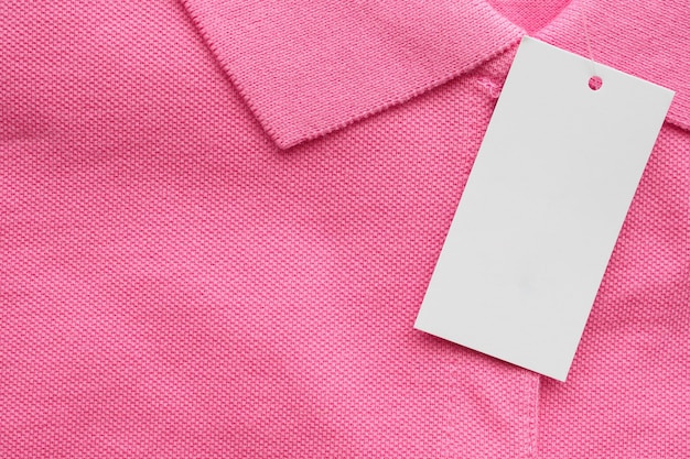 Blank white clothes tag label on new shirt