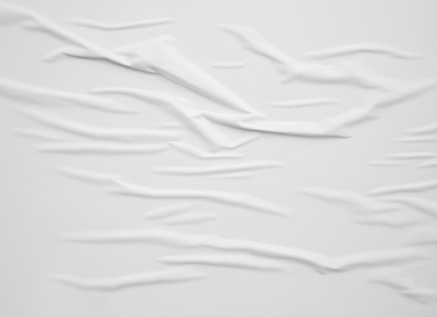 Blank white crumped and creased paper poster texture background