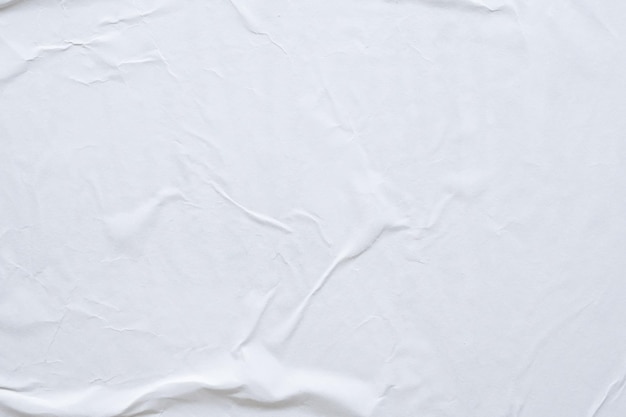 Blank white crumpled and creased paper poster texture background