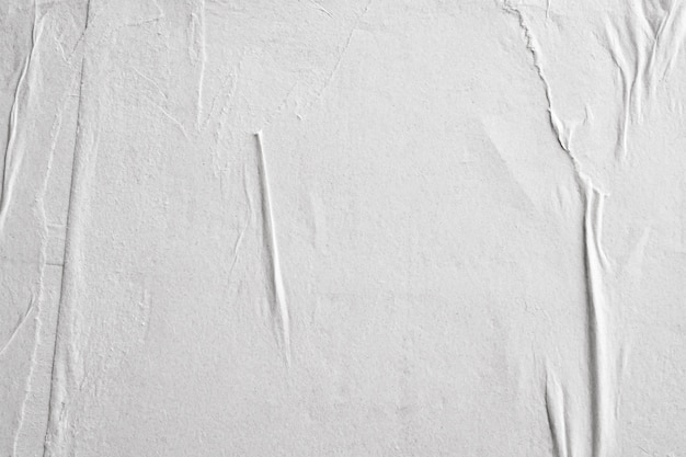 Blank white crumpled and creased paper poster texture background