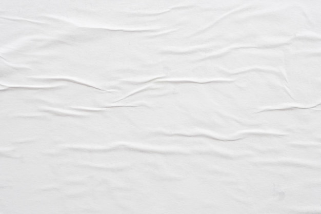 Blank white crumpled and creased paper poster texture background