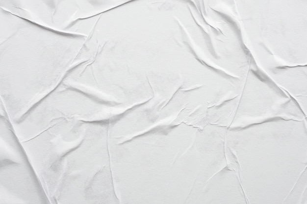 Blank white crumpled and creased paper poster texture background