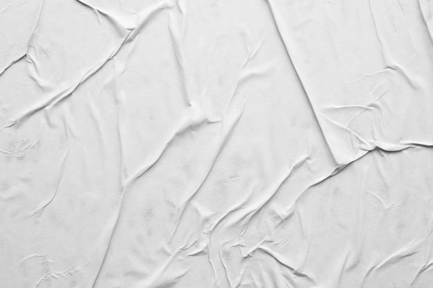 Blank white crumpled and creased paper poster texture background