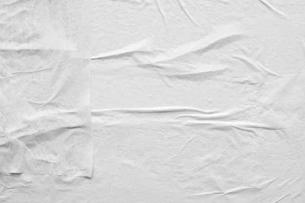 Blank white crumpled and creased paper poster texture background