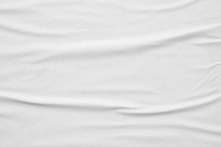 Photo blank white crumpled and creased paper poster texture background