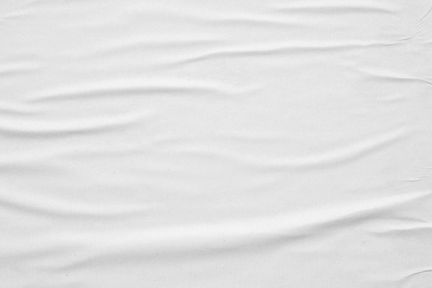 Blank white crumpled and creased paper poster texture background