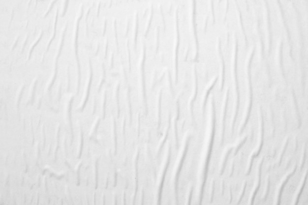 Blank white crumpled and creased paper poster texture background