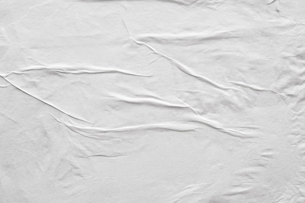 Blank white crumpled and creased paper poster texture background