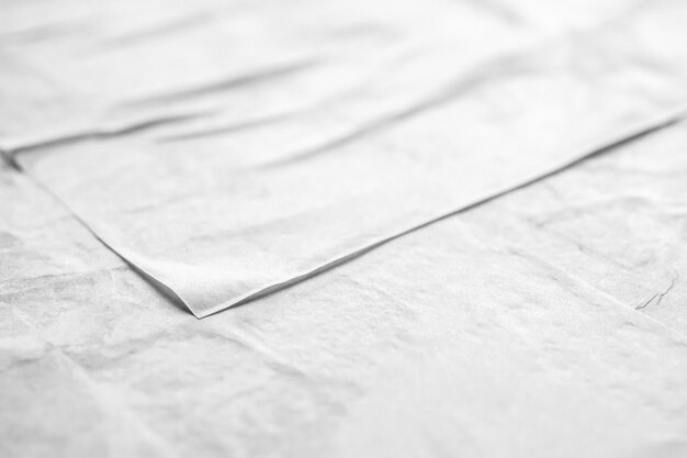 Blank white crumpled and creased paper poster texture