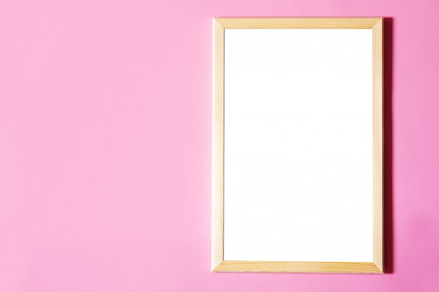 Blank white frame on pink background