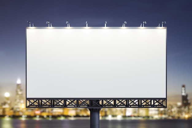 Blank white horizontal billboard on city buildings background at night front view Mockup advertising concept