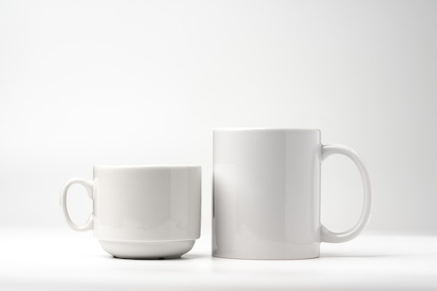 Blank white mugs mock up on white background