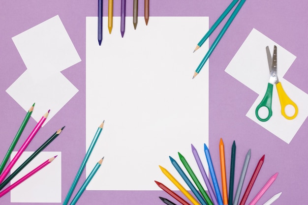 Blank white paper, coloured pencils, scissors. Drawing mockup flat lay