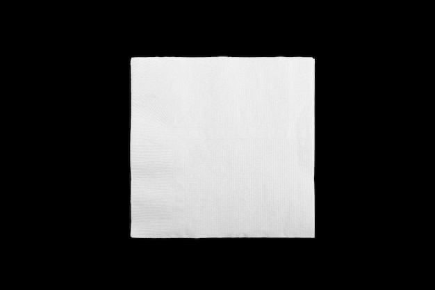 Blank white paper napkin on black background with copy space. Flat lay.