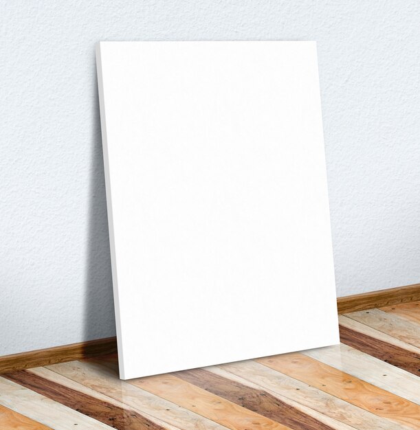 Photo blank white paper poster on white wall and wooden floor