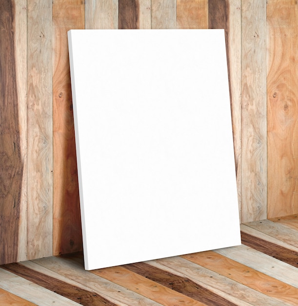 Blank white paper poster on wooden plank wall and floor