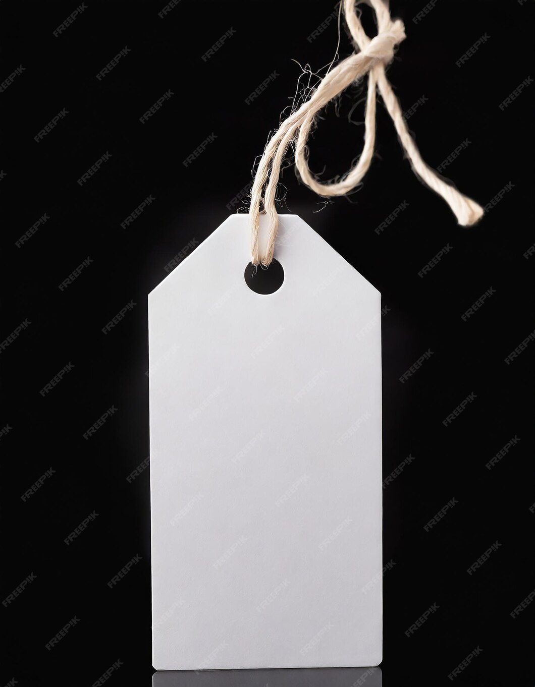 Premium Photo | Blank white paper price tag or gift tag label with cord