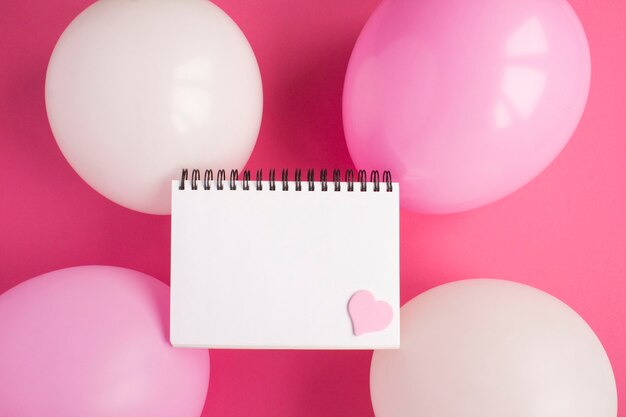 Blank white paper for text, pink and white balloons