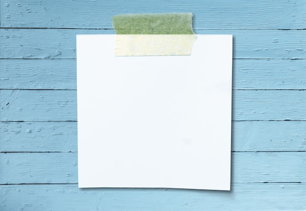 Photo blank white paper on wooden table background