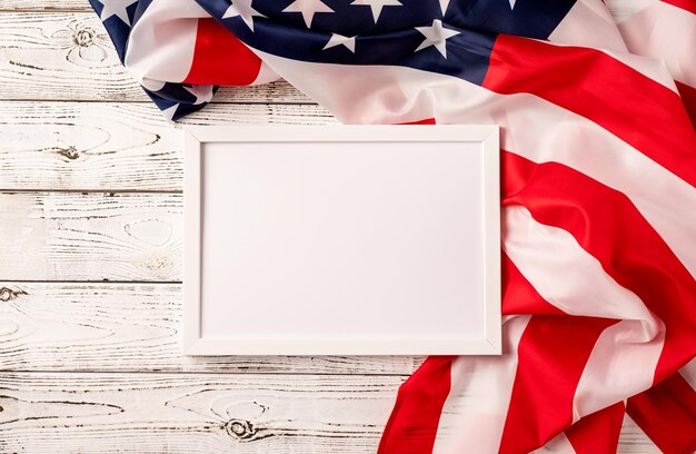 Blank white photo frame for mockup design on american national flag wooden background