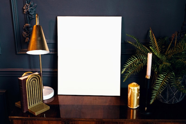 Blank white photo frame in a modern stylish interior designer accessories table lamp