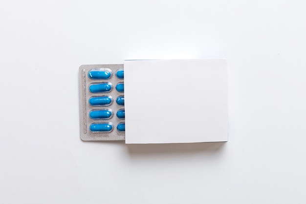 Photo blank white product package box mockup open blank medicine drug box with blister top view