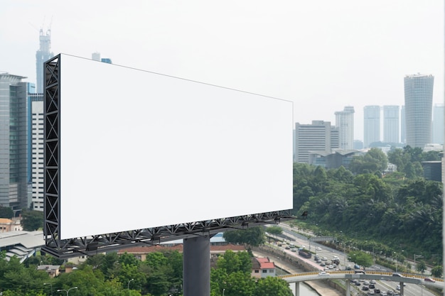 Blank white road billboard with KL cityscape background at day time Street advertising poster mock up 3D rendering Side view The concept of marketing communication to promote or sell idea