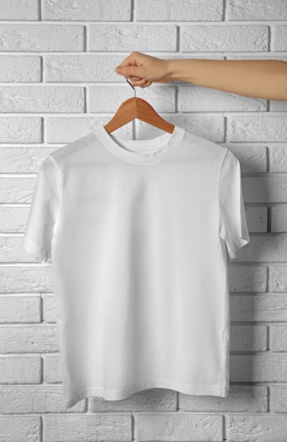 Photo blank white tshirt against brick wall