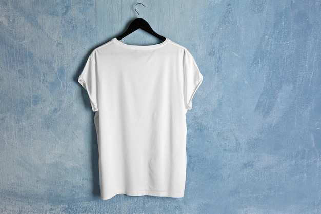 Blank white tshirt on grunge background