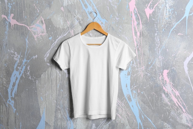 Blank white tshirt on grunge background