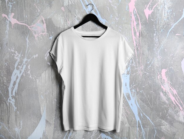 Blank white tshirt on grunge background