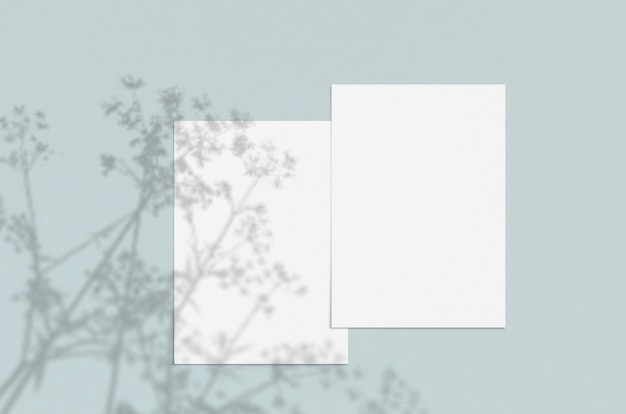 Blank white vertical paper sheet with shadow overlay.