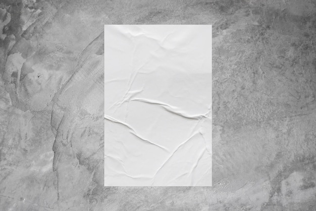 Blank white wheatpaste glued paper poster mockup on concrete wall background