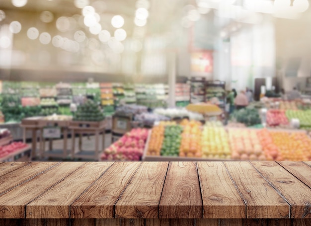 Photo blank of wood top table at blurred supermarket