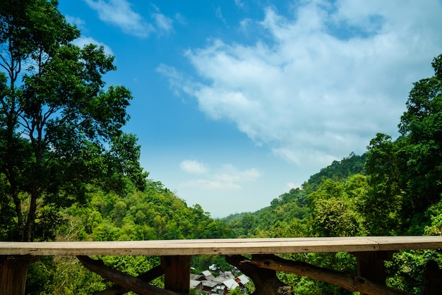 Photo blank wooden chair and long table on terrace with landscape mountain view