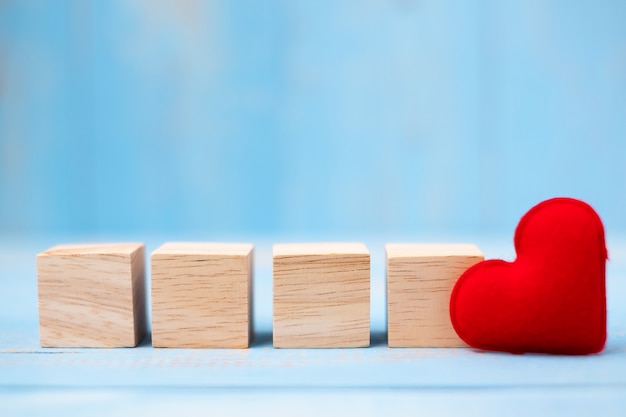 Blank wooden cubes with red heart shape decoration 