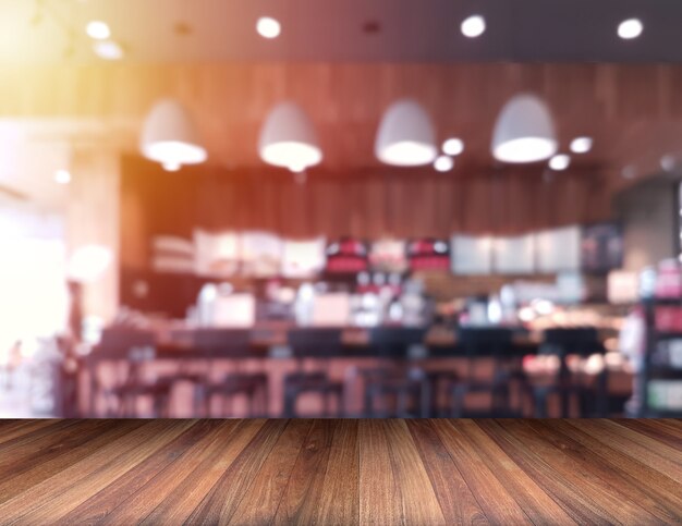 Photo blank wooden table in a coffee shop