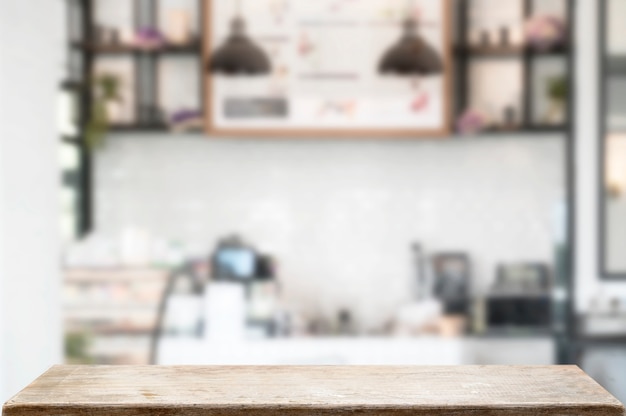 Blank wooden top table in cafe, copy space for product display.