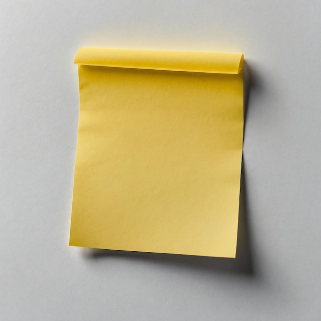 A blank yellow sticky note on white background