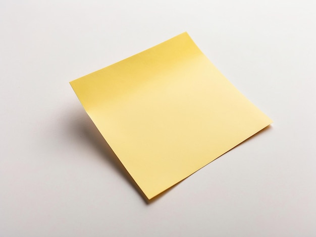 Blank yellow sticky note on white surface